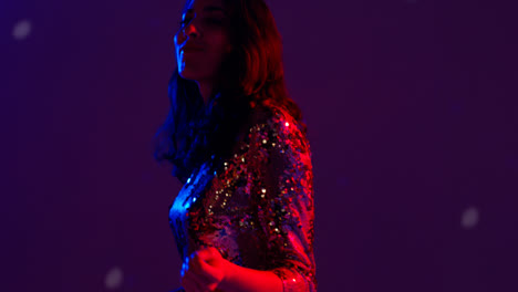 Close-Up-Of-Woman-In-Nightclub-Bar-Or-Disco-Dancing-With-Sparkling-Lights-11